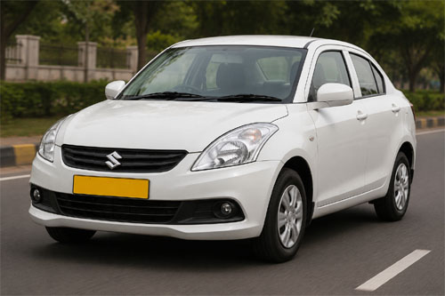 White Swift Dzire taxi with yellow commercial plate